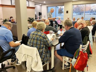 Roger Wells discusses different types of cancer at YMCA Coffee Conversations on January 6, 2026.